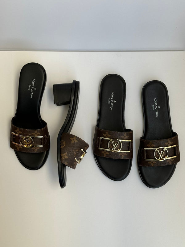 Lv Lock It Mules In Monogram Canvas